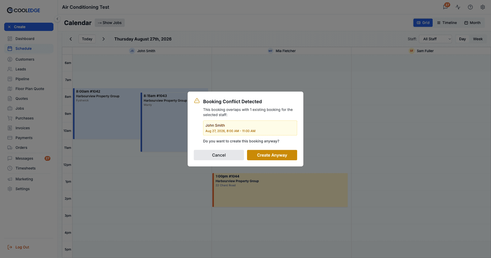The Booking Conflict Detected modal, which names only the staff member who clashes